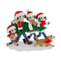Personalized tree farm family of four ornament with bundled-up family members carrying a Christmas tree and walking with a dog.