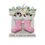 Personalized twin penguin stocking ornament with two pink stockings, two baby names on the hats, a year on the mantel, and the phrase “Twice As Nice For Christmas” on the base.
