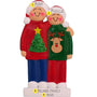 Decorative ornament of a couple wearing Christmas-themed sweaters with personalized names and family information.