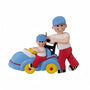 Decorative figurine of a man and childbon a toy car ornament with  a white background.