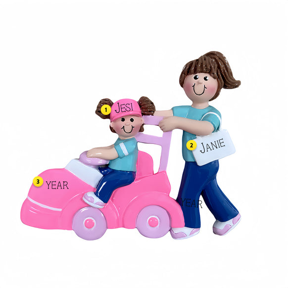  This sweet design shows a proud older sister pushing a little one in a toy car.