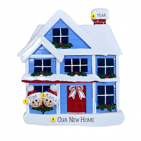 Decorative Christmas house ornament with snow, windows, and a red door on a white background