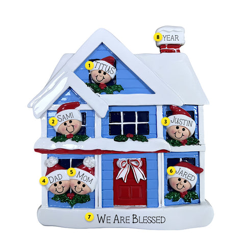 Decorative Christmas house ornament with family members on a white background