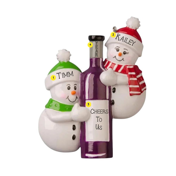 Personalized wine bottle couple ornament with two smiling snowmen, names on their hats, a year on the bottle neck, and “Cheers To Us” on the label.