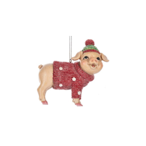 Pig in Cozy Sweater ornament featuring a smiling pig wearing a red polka dot sweater and green winter hat with a red pom-pom.