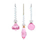 Three pink crystal beaded drop ornaments with faceted diamond, teardrop, and round shapes, each topped with iridescent bead strands.