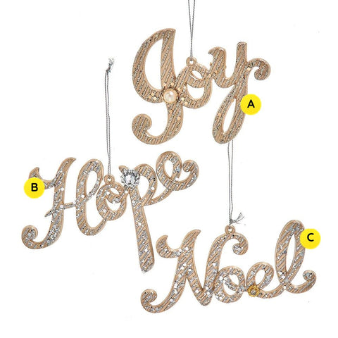 Three platinum glitter script Christmas word ornaments reading Joy, Hope, and Noel, each with silvery glitter accents and small jewel details.