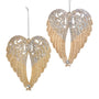 Two glittered angel wing ornaments in champagne and platinum finishes with scroll details, feather texture, and faceted jewel accents.