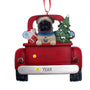 Christmas ornament of a pug in a red truck with a tree and presents on a white background can be personalized