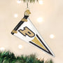 Decorative ornament shaped like a pennant with a Purdue logo, hanging on a Christmas tree.