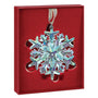 Iridescent snowflake ornament in a red box