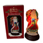 Illuminated Old World Christmas 2011 Radiant Santa Light displayed beside its original red product box