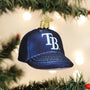 Navy blue baseball cap ornament with 'TB' logo on a Christmas tree.