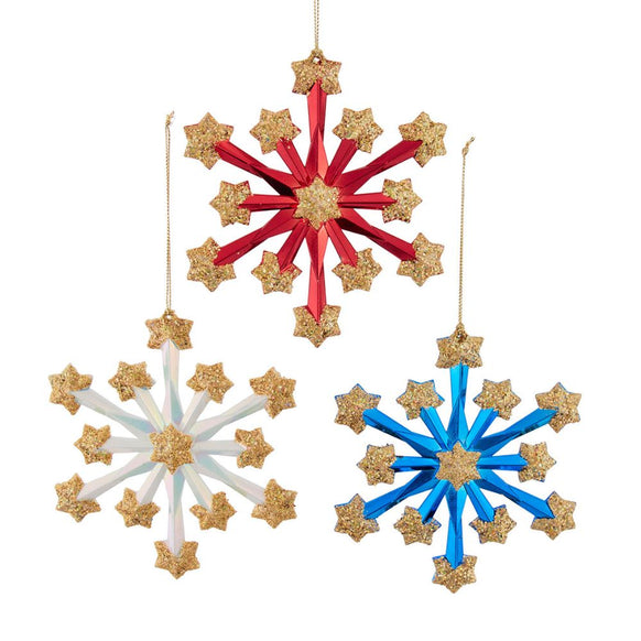 Three fireworks-style snowflake ornaments in red, white, and blue with gold glitter stars and gold hanging cords.
