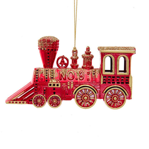 Red and gold train ornament shaped like a vintage locomotive with glittered accents, detailed wheels, and a gold hanging cord.