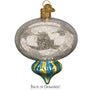 Decorative glass reflector ornament with gold and blue accents on a white background back of ornament