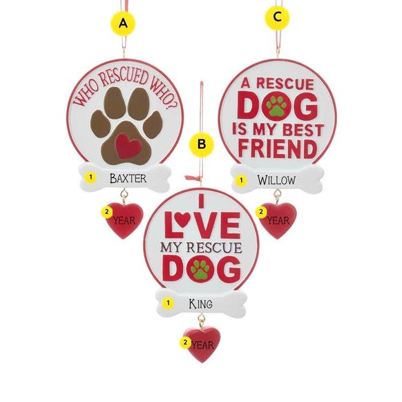 Three personalized rescue dog ornaments with round white and red sign designs, sample pet name personalization on bone nameplates, and dangling red heart accents for the year.