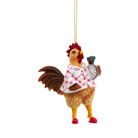 Rooster ornament in white plaid pajamas, holding a small alarm clock and wearing red glitter accents on its comb and wattle.