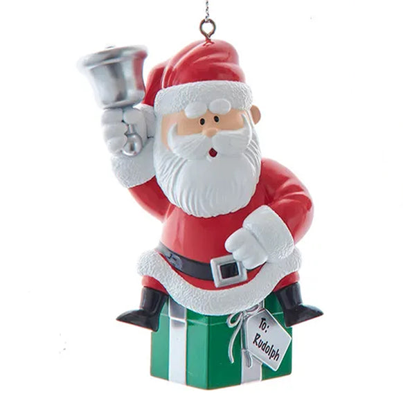 Santa from Rudolph the red nose reindeer ornament on a white background