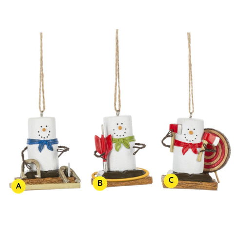 Three S’mores Outdoor Game ornaments shown together, each featuring a marshmallow snowman-style figure on a graham cracker base with a different backyard game: horseshoes, archery, or axe throwing.