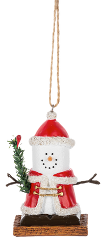 S’mores Santa ornament featuring a marshmallow snowman-style face, red Santa hat and coat with white trim, twig arms, and evergreen branch accents on a graham cracker-style base.