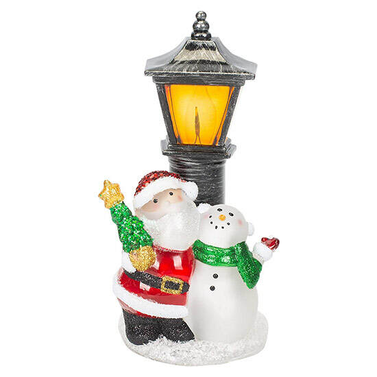 Santa and Snowman Lamppost Night-Light featuring Santa holding a glittered Christmas tree beside a snowman beneath a glowing black lamppost