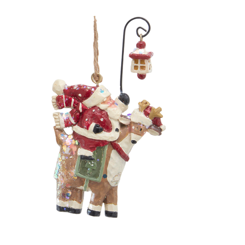 Glittered Santa riding beside a reindeer beneath a small hanging lamppost ornament.