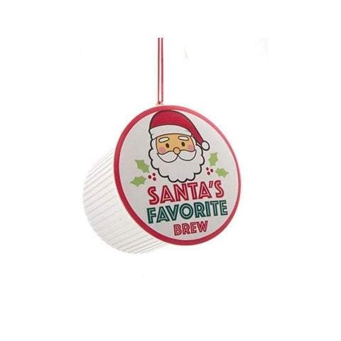 Coffee pod ornament with a Santa label reading “Santa’s Favorite Brew” hanging from a red cord.