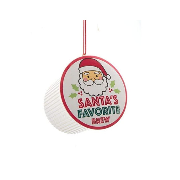 Coffee pod ornament with a Santa label reading “Santa’s Favorite Brew” hanging from a red cord.