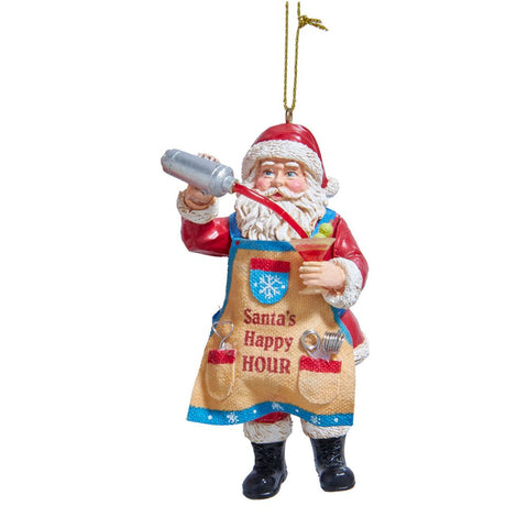 Santa ornament wearing a festive apron that reads Santa’s Happy Hour, holding a cocktail glass and pouring from a silver shaker.