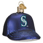 Glass ornament shaped like a blue baseball cap with a Mariners logo on a white background