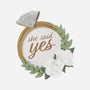 Decorative ornament with 'she said yes' text, ring, flowers, and leaves on a white background