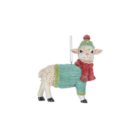 Sheep in Cozy Sweater ornament featuring a woolly sheep wearing a blue-green sweater, red scarf, and matching winter hat.
