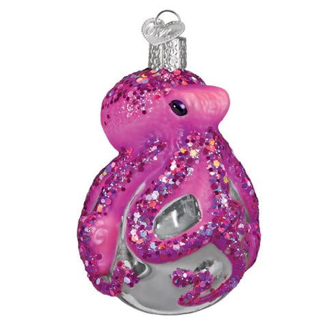 Decorative pink glittery Octopus ornament on a white background