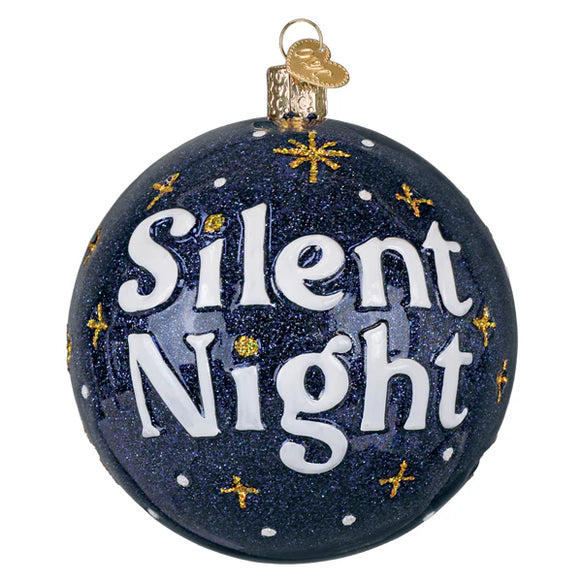 Decorative Christmas ornament with 'Silent Night' text on a blue glitter background.