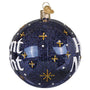 Decorative Christmas ball ornament with text and star designs on a blue glittery background. Side view