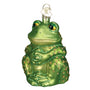 Green frog ornament with decorative elements on a white background