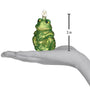 Green frog-shaped ornament held in a hand with a measurement indicator showing 3 inches.
