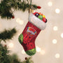 Skittles-themed Christmas stocking ornament on a tree with blurred lights in the background