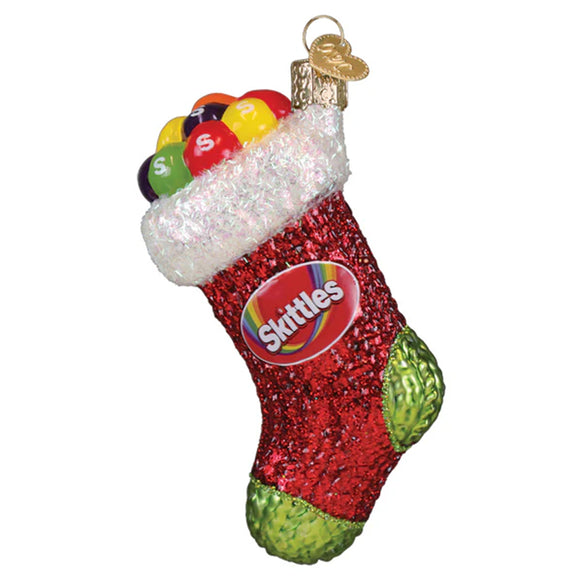 Skittles-themed Christmas stocking ornament on a white background