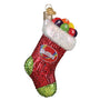 Decorative stocking ornament with Skittles candy on a white background