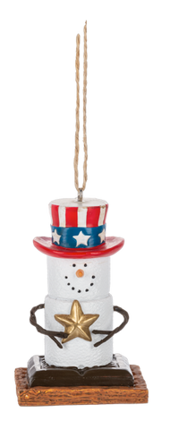S’mores Americana ornament featuring a marshmallow snowman character wearing a red, white, and blue top hat and holding a gold star.