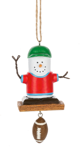 S’mores Football Fan ornament featuring a marshmallow character in a red shirt and green cap with a dangling football accent.