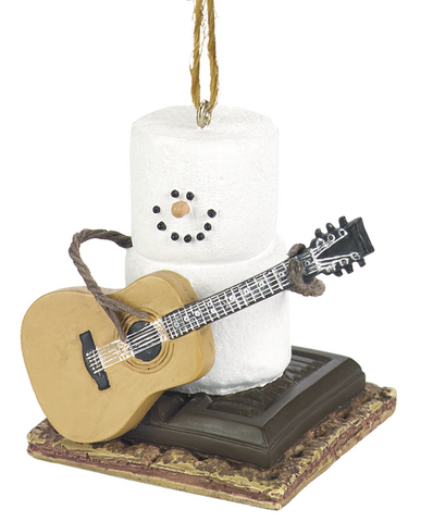 S’mores Guitar ornament featuring a marshmallow snowman with pretzel stick arms holding an acoustic guitar while sitting on a chocolate and graham cracker base.
