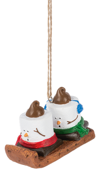 Mini S’mores Toboggan ornament featuring two marshmallow characters riding a brown sled with red and green scarves and blue earmuffs.