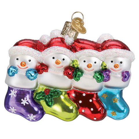 Snowfamily of 4 happy snowmen peek from festive stockings on white background