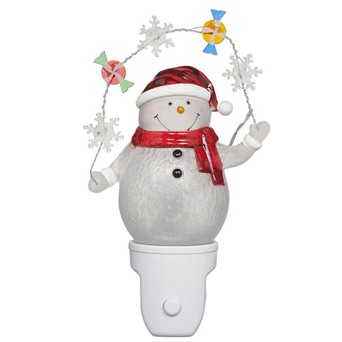 Snowman with Candy and Snowflake Garland Night-Light featuring a smiling snowman in a red hat and scarf holding a sparkling holiday garland