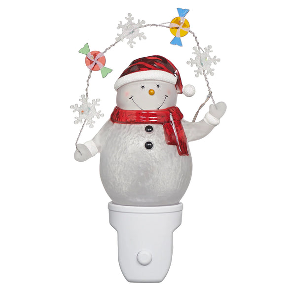 Snowman with Candy and Snowflake Garland Night-Light featuring a smiling snowman in a red hat and scarf holding a sparkling holiday garland