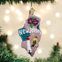 Decorative Christmas ornament shaped like New Jersey with floral and bird designs, hanging on a Christmas tree.