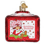 Decorative ornament featuring Strawberry Shortcake on a red background